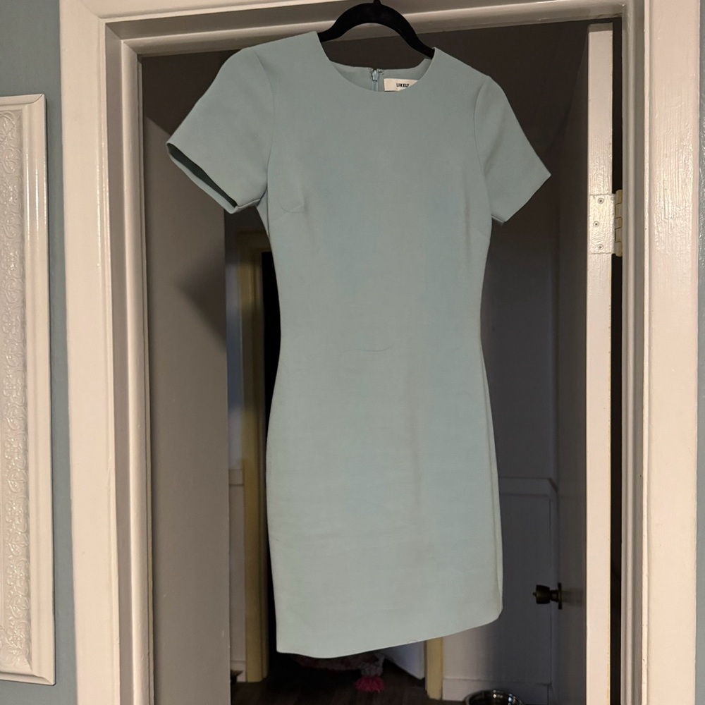 Likely light blue dress